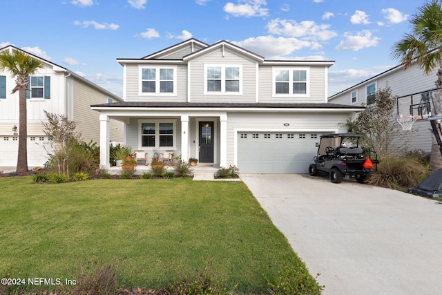 view of front of house with covered porch, a garage, and a front lawn