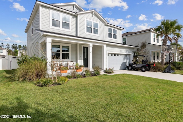 view of front of property featuring covered porch, a garage, and a front yard