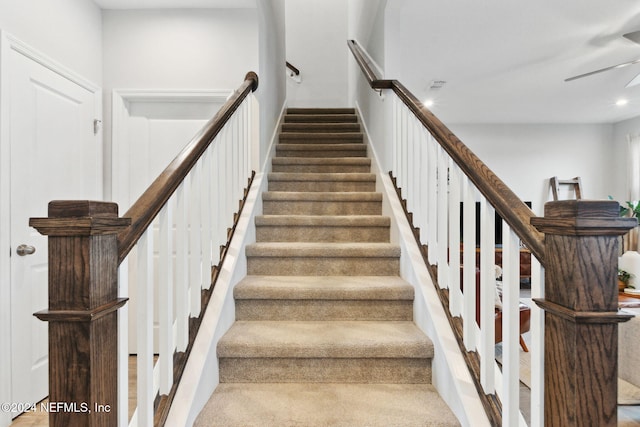 staircase with wood-type flooring