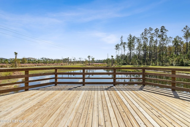 dock area with a deck with water view