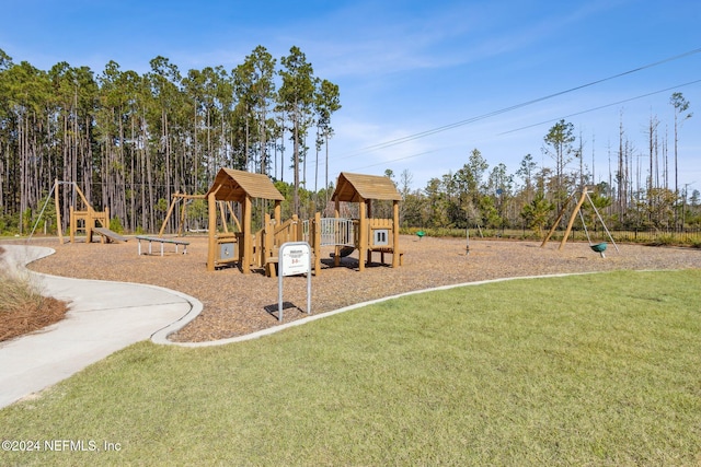 view of jungle gym with a lawn