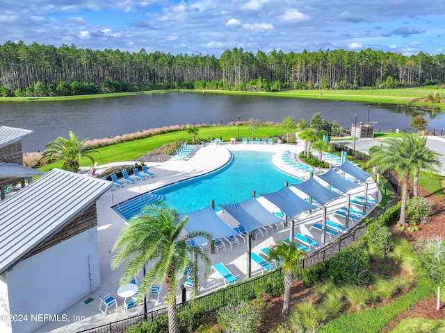 view of swimming pool with a water view and a patio