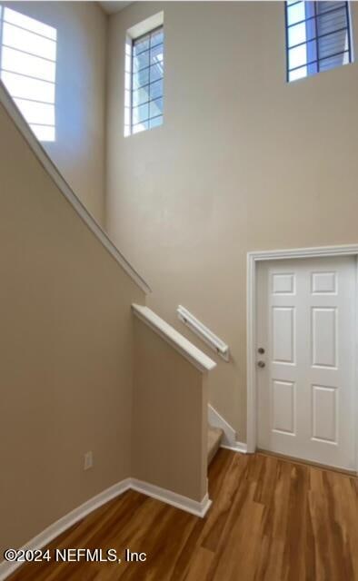 stairway featuring hardwood / wood-style floors