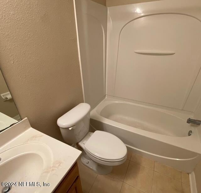 full bathroom featuring tile patterned floors, vanity, toilet, and shower / washtub combination