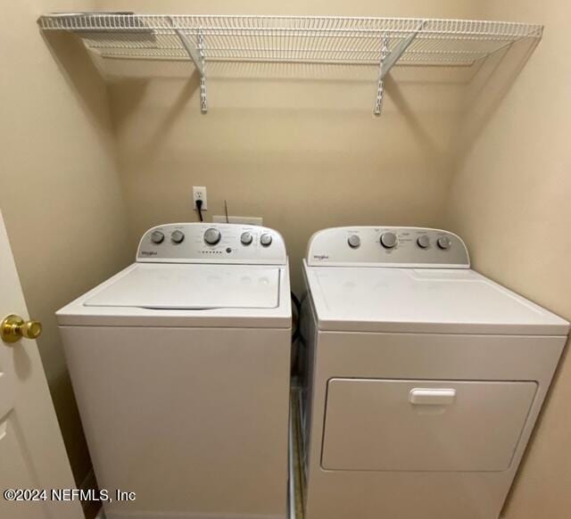 washroom with washer and dryer