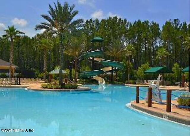 view of swimming pool featuring a water slide