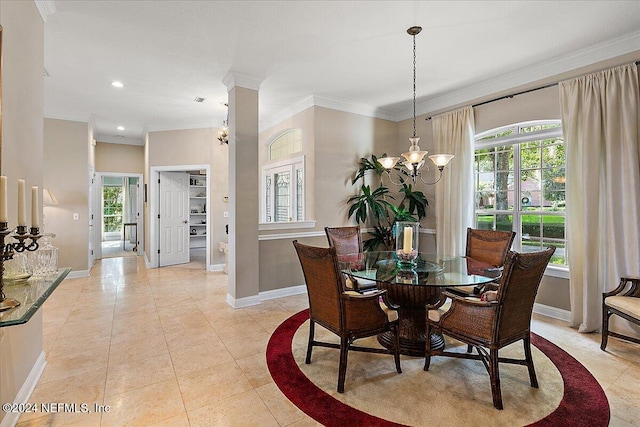 dining space with ornamental molding, light tile patterned floors, a healthy amount of sunlight, and an inviting chandelier