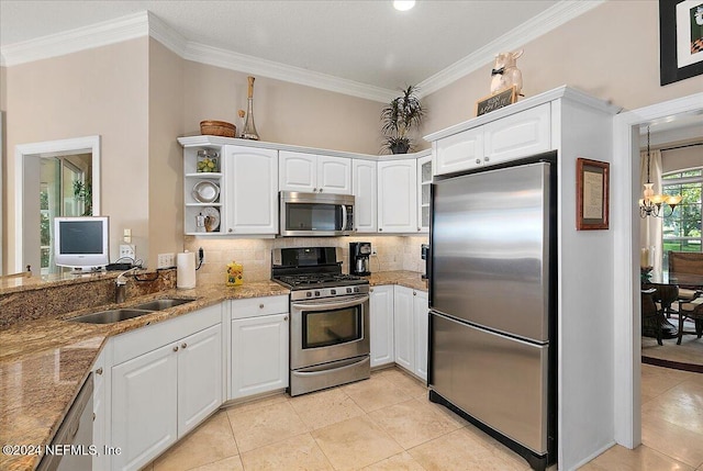 kitchen featuring white cabinetry, sink, crown molding, and stainless steel appliances