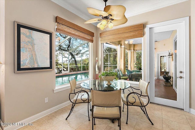 sunroom featuring a wealth of natural light, ceiling fan, and a pool