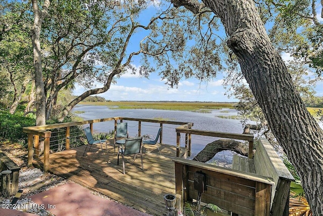 dock area featuring a deck with water view