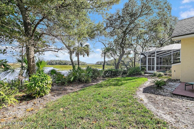 view of yard featuring a lanai