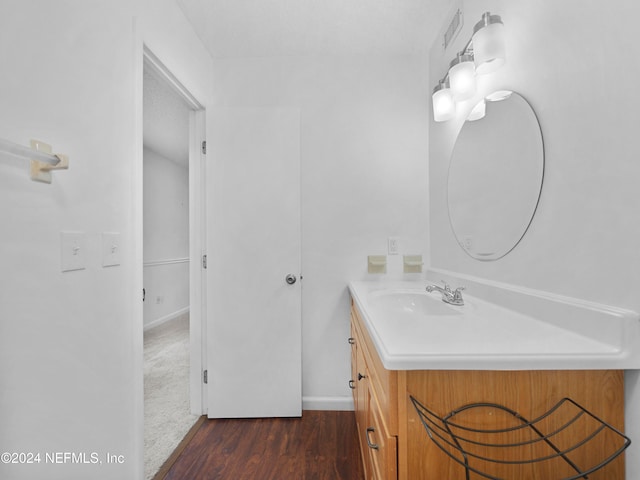 bathroom featuring hardwood / wood-style floors and vanity