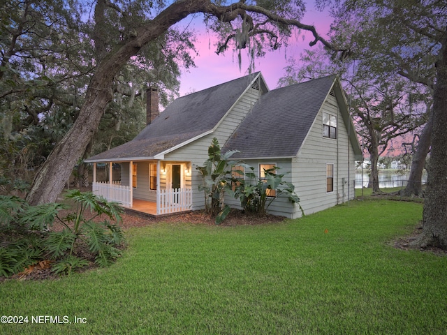 exterior space with a lawn and covered porch