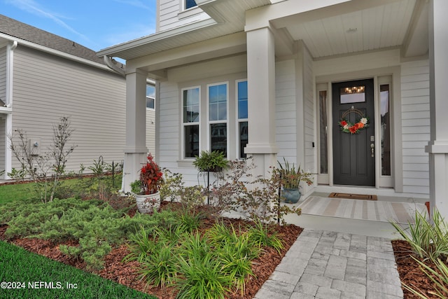 doorway to property with a porch