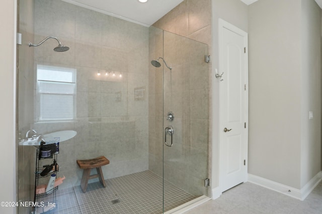 bathroom featuring a shower with door and tile patterned flooring