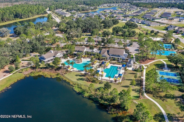 birds eye view of property with a water view