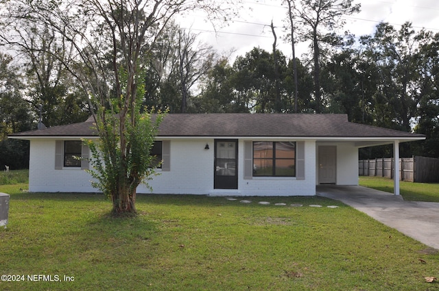 ranch-style home with a front lawn and a carport