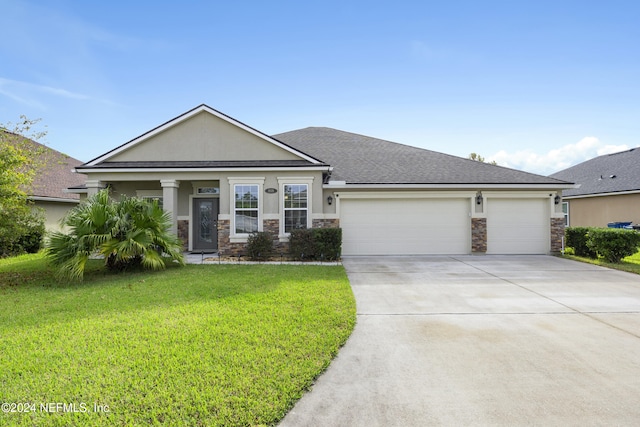 view of front of home featuring a garage and a front yard