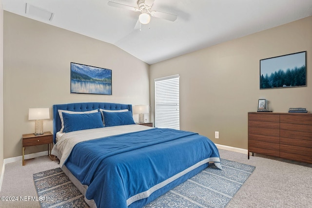 carpeted bedroom with ceiling fan and lofted ceiling