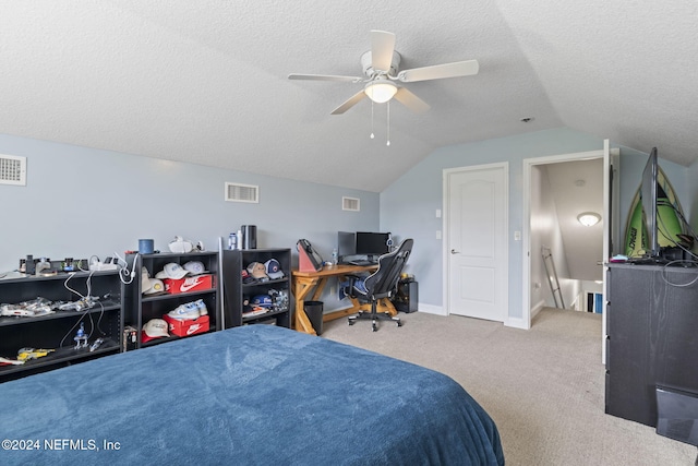 carpeted bedroom with ceiling fan, lofted ceiling, and a textured ceiling