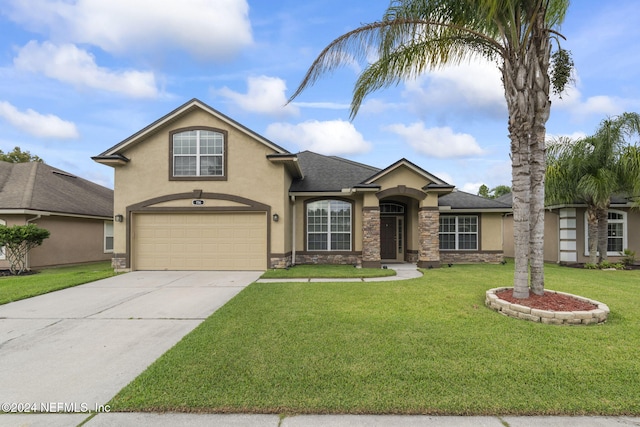 view of front facade with a garage and a front lawn