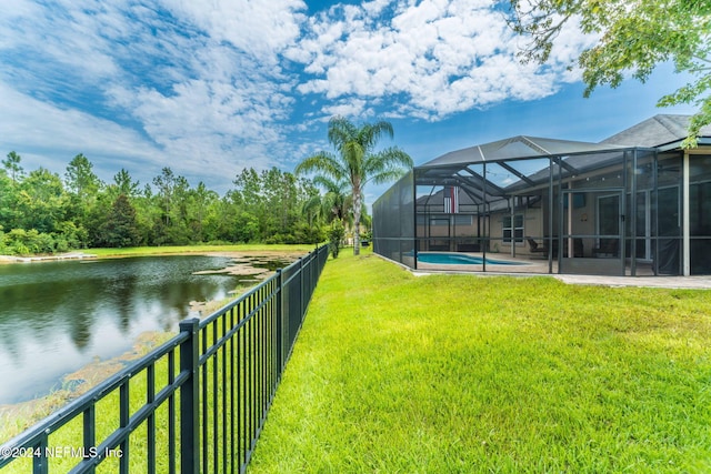 view of yard featuring a water view, a fenced in pool, and a lanai