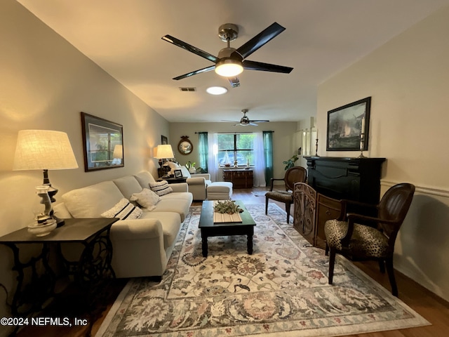 living room with hardwood / wood-style flooring and ceiling fan