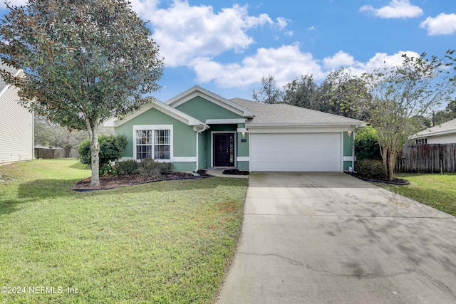 view of front facade with a garage and a front lawn