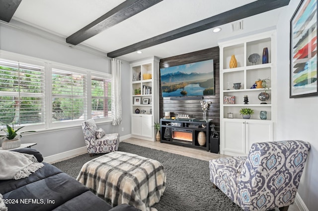 living room with hardwood / wood-style flooring and beam ceiling