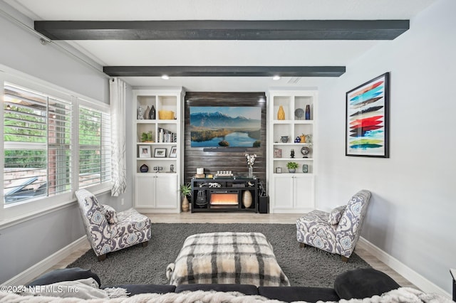 living room with beam ceiling