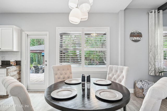 dining space featuring light hardwood / wood-style flooring