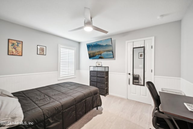 bedroom featuring ceiling fan and light colored carpet