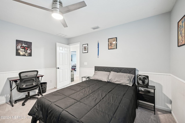 bedroom with ceiling fan and carpet floors