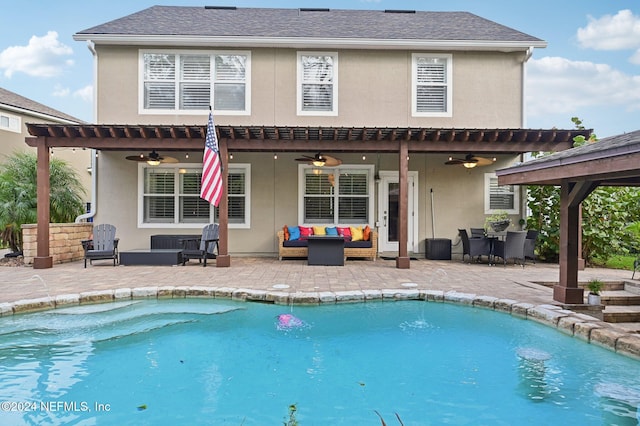 back of house featuring outdoor lounge area, a patio, and ceiling fan