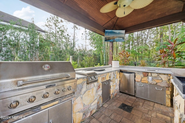 view of patio / terrace with an outdoor kitchen, ceiling fan, and a grill