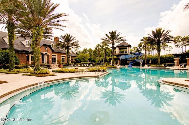 view of pool with a water slide