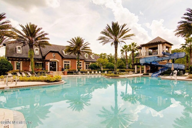 view of swimming pool featuring a water slide