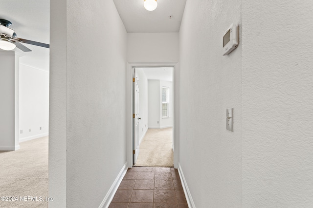 corridor with carpet flooring