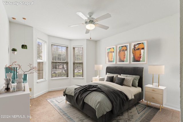 bedroom with ceiling fan and carpet