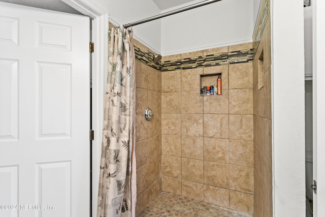 bathroom featuring a shower with curtain