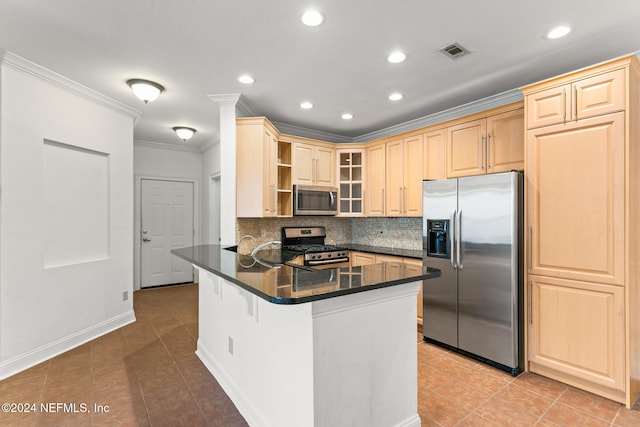 kitchen featuring light brown cabinets, a kitchen breakfast bar, appliances with stainless steel finishes, tasteful backsplash, and kitchen peninsula