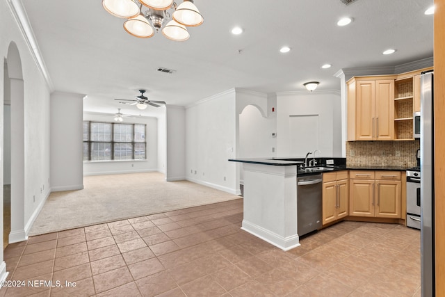 kitchen featuring appliances with stainless steel finishes, ceiling fan with notable chandelier, light colored carpet, sink, and light brown cabinets