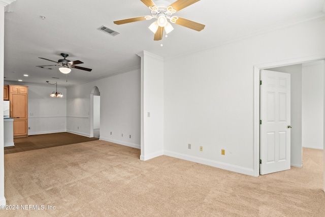 unfurnished living room featuring crown molding, light colored carpet, and ceiling fan with notable chandelier