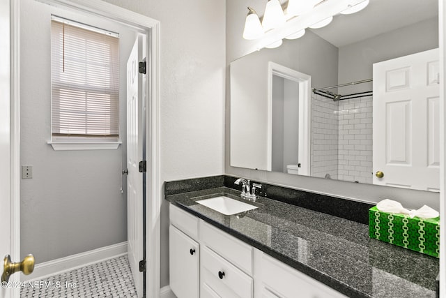 bathroom featuring tile patterned flooring and vanity