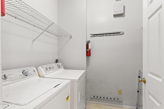 laundry area with washing machine and dryer