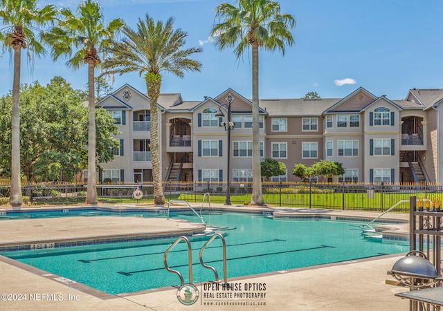 view of swimming pool with a patio area