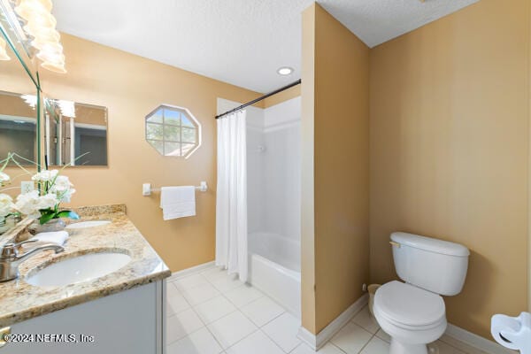 full bathroom with toilet, vanity, tile patterned floors, and shower / bathtub combination with curtain