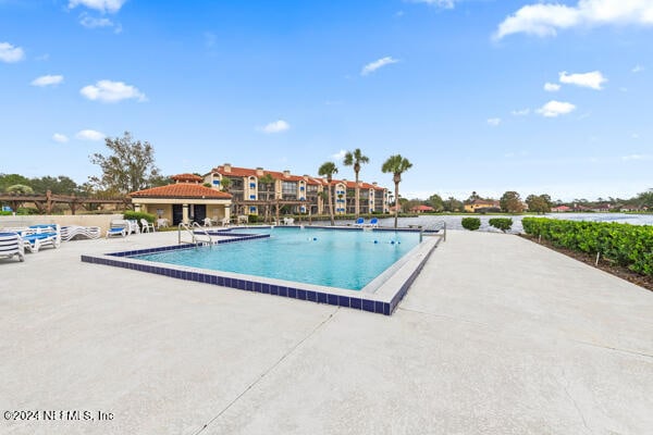 view of swimming pool with a patio