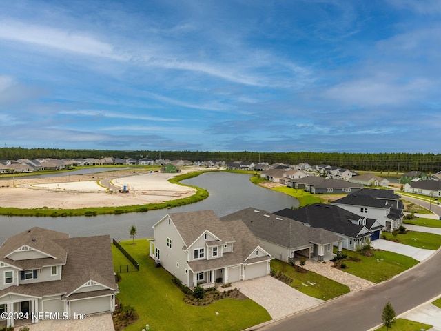 birds eye view of property featuring a residential view and a water view