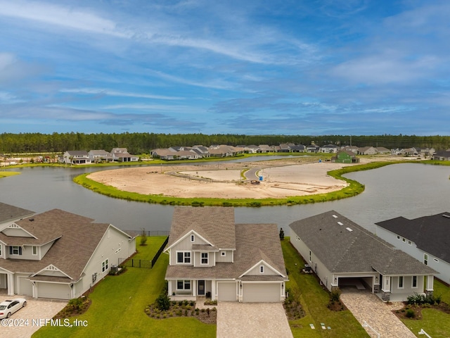 birds eye view of property with a residential view and a water view